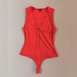 Orange bodysuit with silver ring